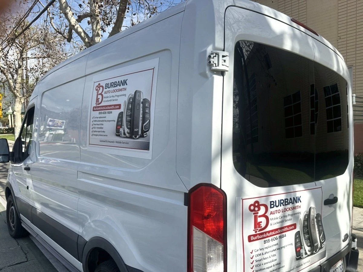 Burbank Auto Locksmith service van with company branding and phone number on the side and rear doors